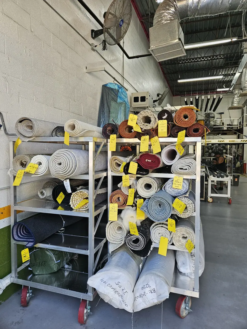 Racks of binding and serging tape spools with work tags